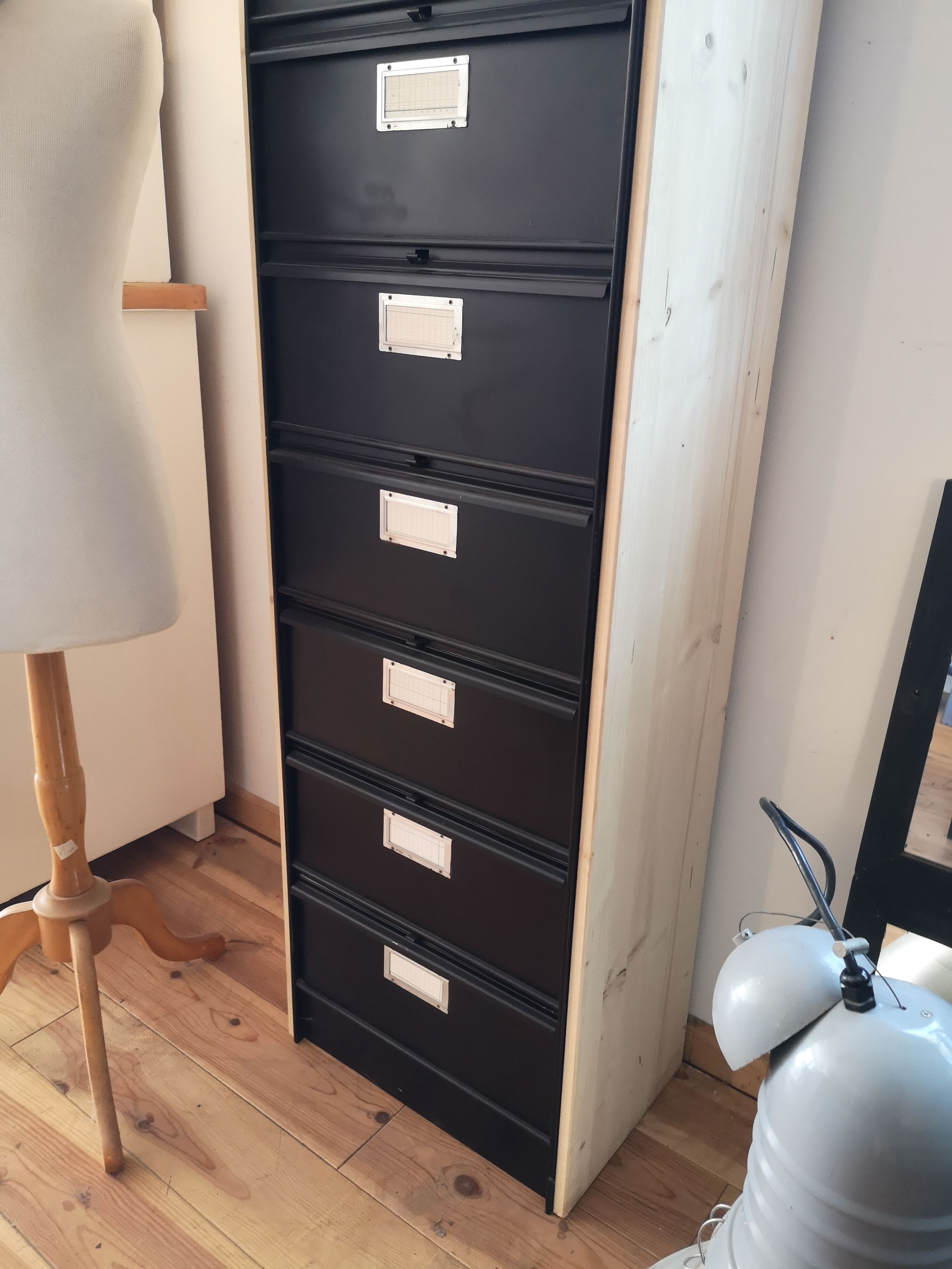 Metal column ten valves storage cabinet administration. Black mast and wood color