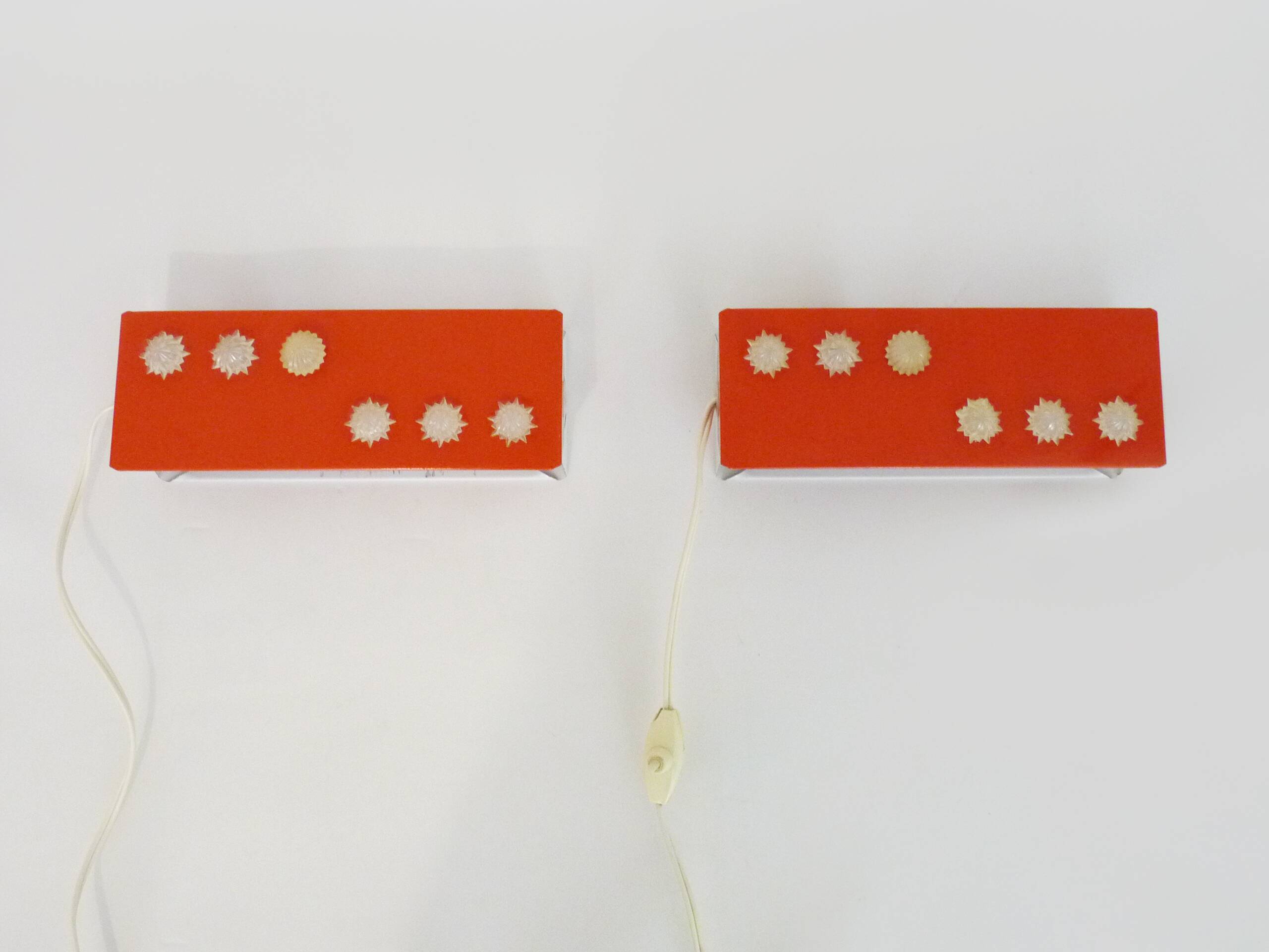 Pair of Scandinavian wall sconces with swivel shade in orange metal. 70