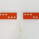 Pair of Scandinavian wall sconces with swivel shade in orange metal. 70