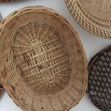 Wall composition of 8 baskets and wicker trays.