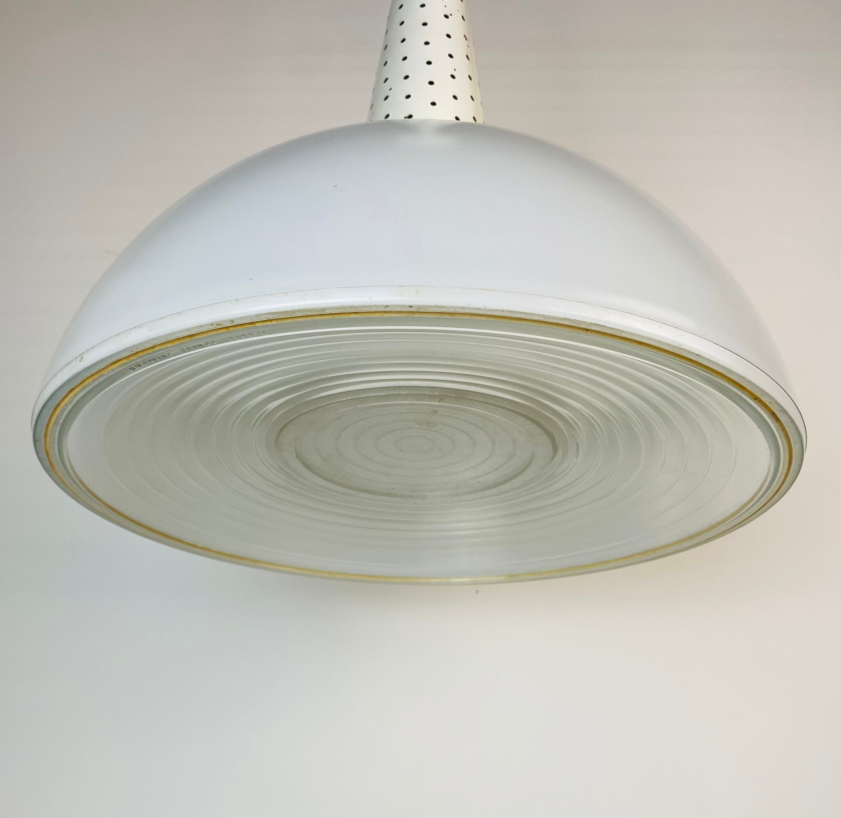 Perforated metal suspension holophanous glass