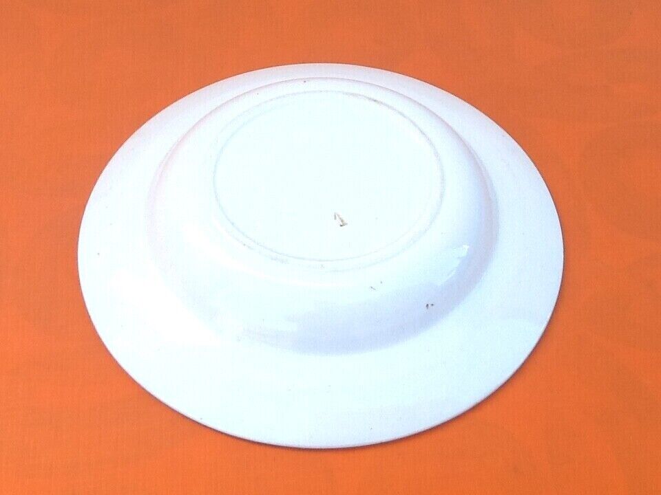 Old hollow dish Polychrome earthenware Floral decoration Diameter: 255mm