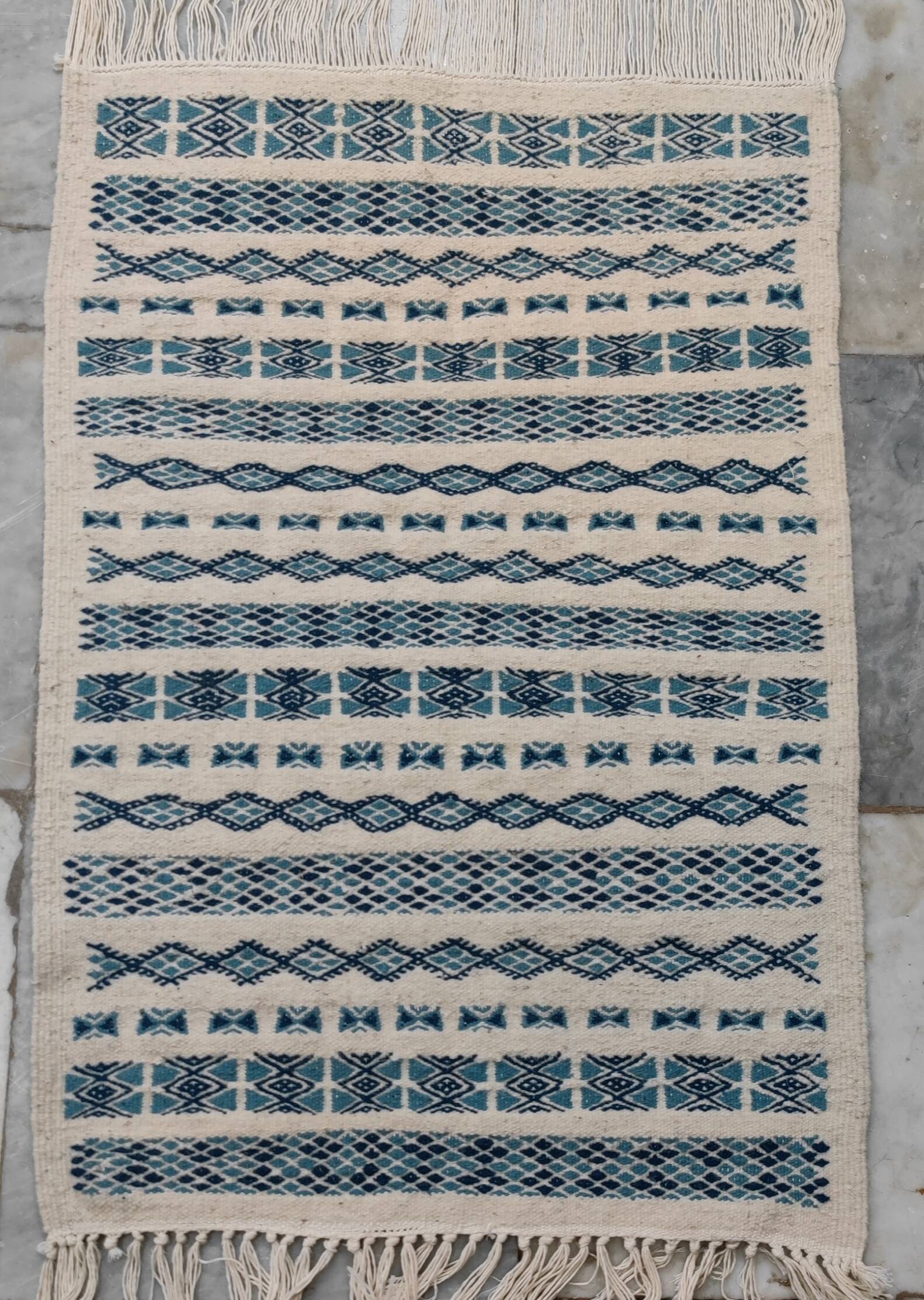 Traditional handmade white and blue carpet