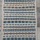Traditional handmade white and blue carpet