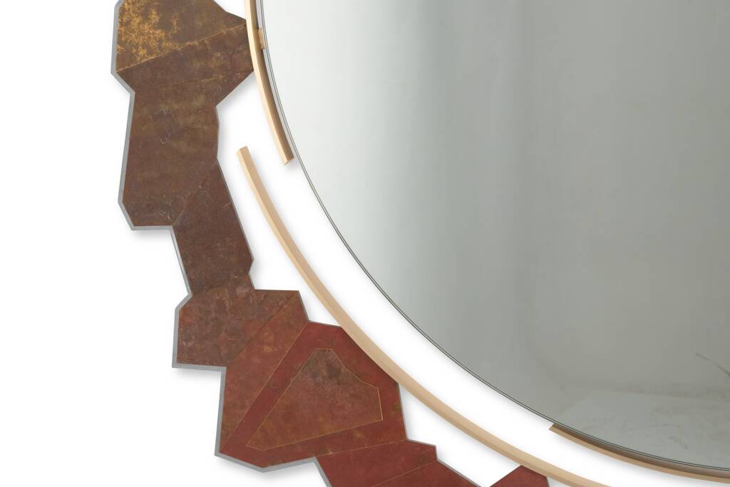 Contemporary mirror in oxidized bronze and brass with a deconstructed shape.