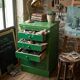 Vintage workshop furniture with 6 green drawers.