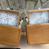 Renovated bedside tables in laurel green and light wood.