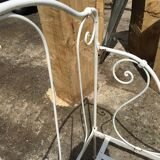 Ancient white metal bed