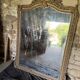 Large antique mirror in wood and gilded stucco.