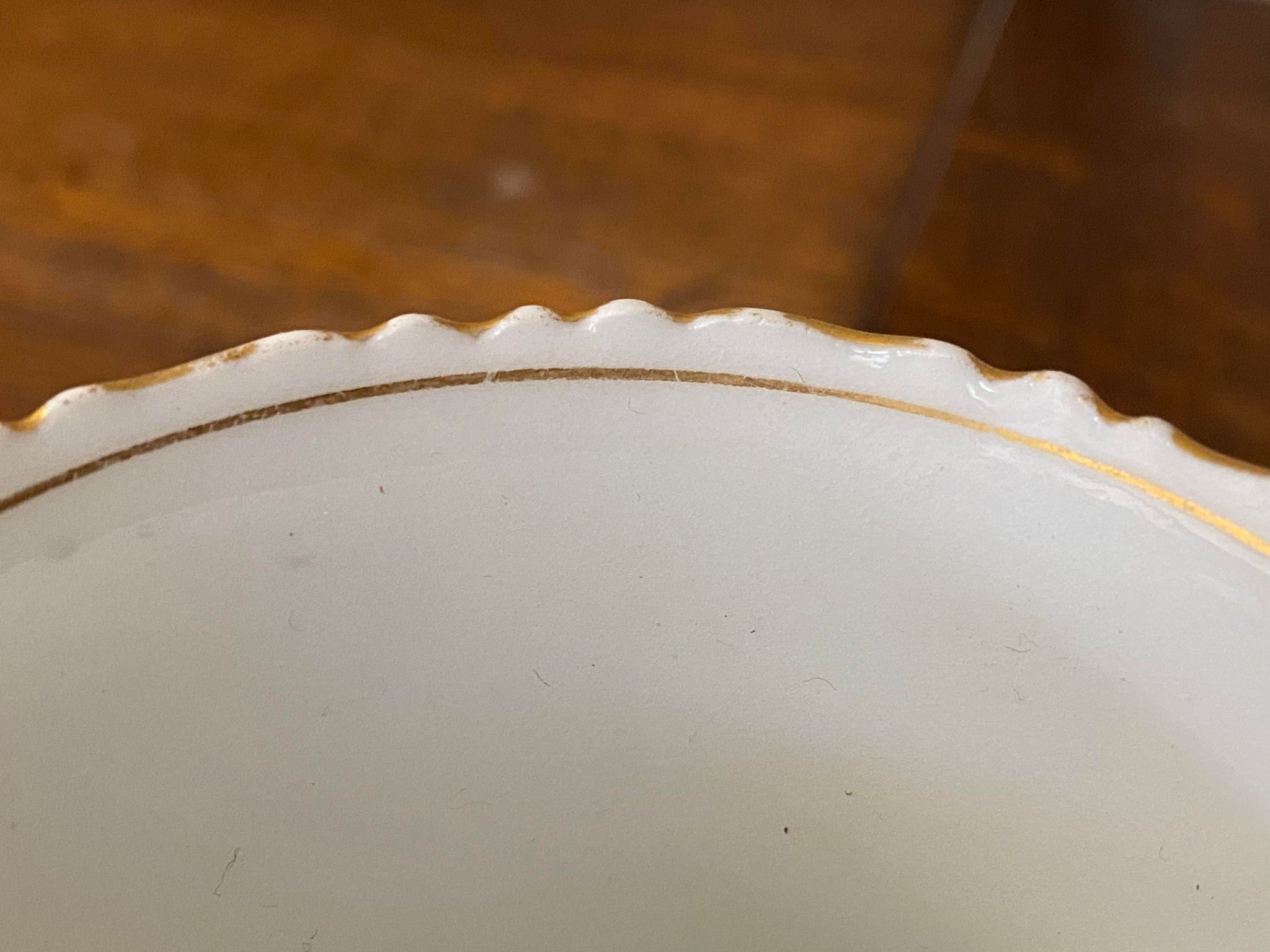Porcelain cup with chiseled and gilded rim
