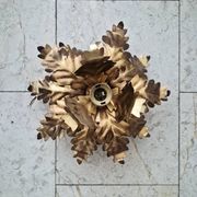 Vintage floral metal applique in gold.