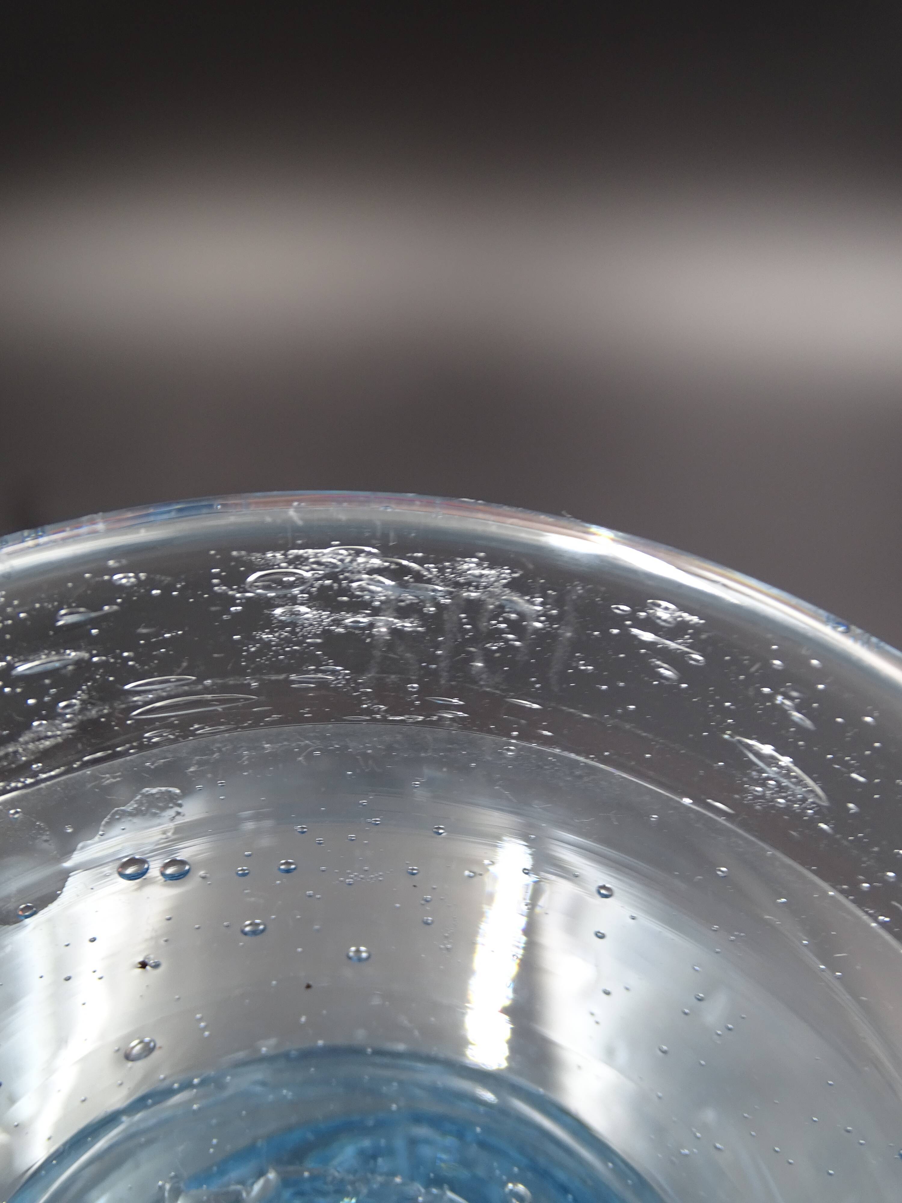 Candlestick or photophore in sky blue bulled glass, signed Biot