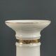 Pair of porcelain candlesticks with a gold pattern.
