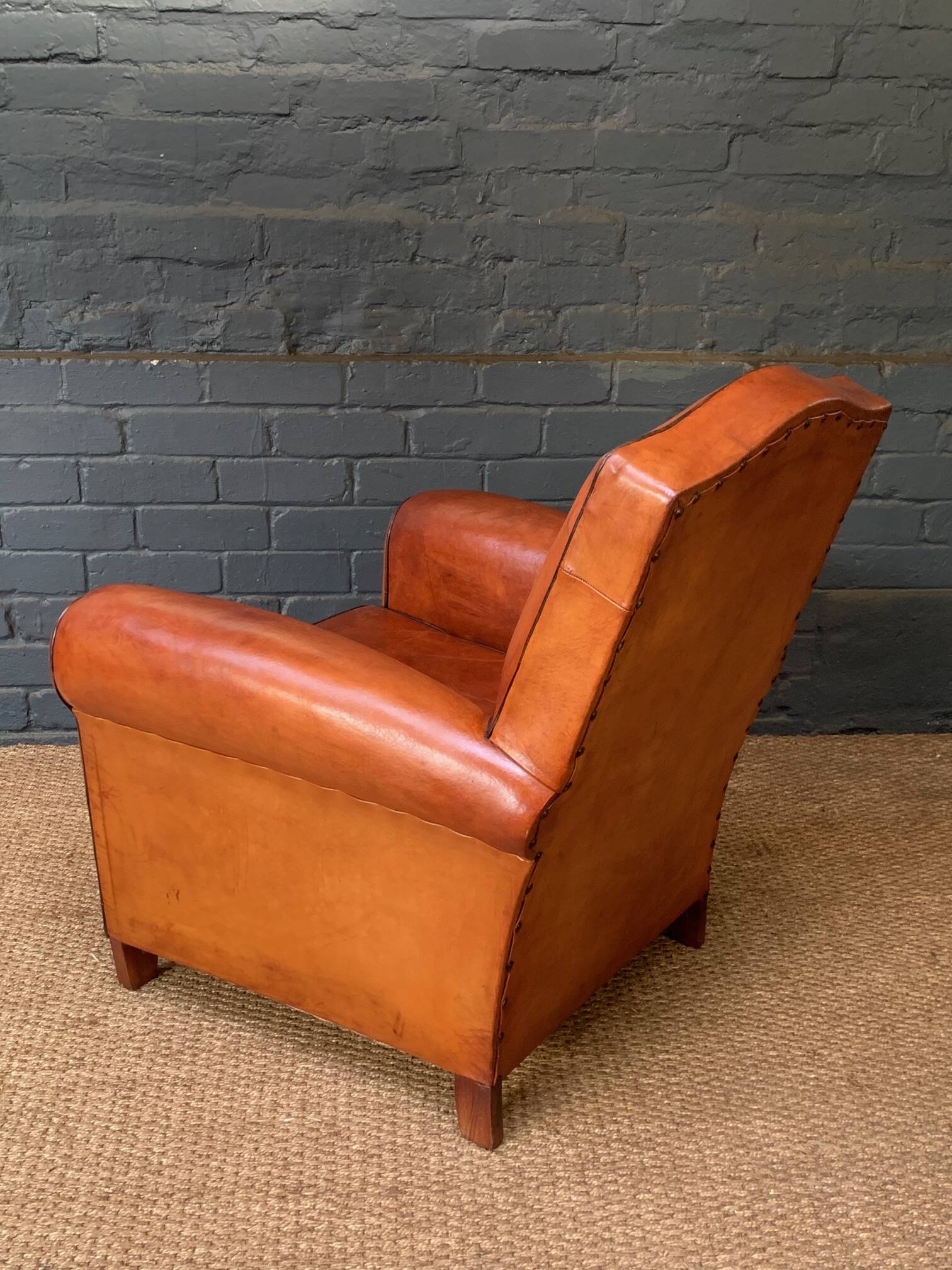 French leather club chair, chapeau de gendarme model circa 1930's in caramel