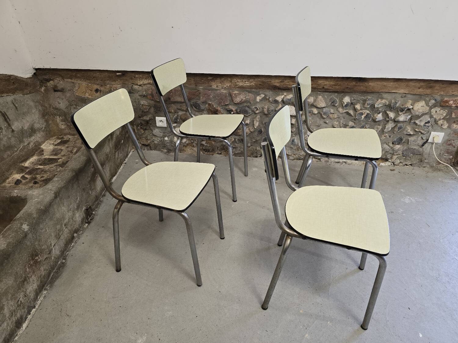 Set of 4 light yellow formica chairs