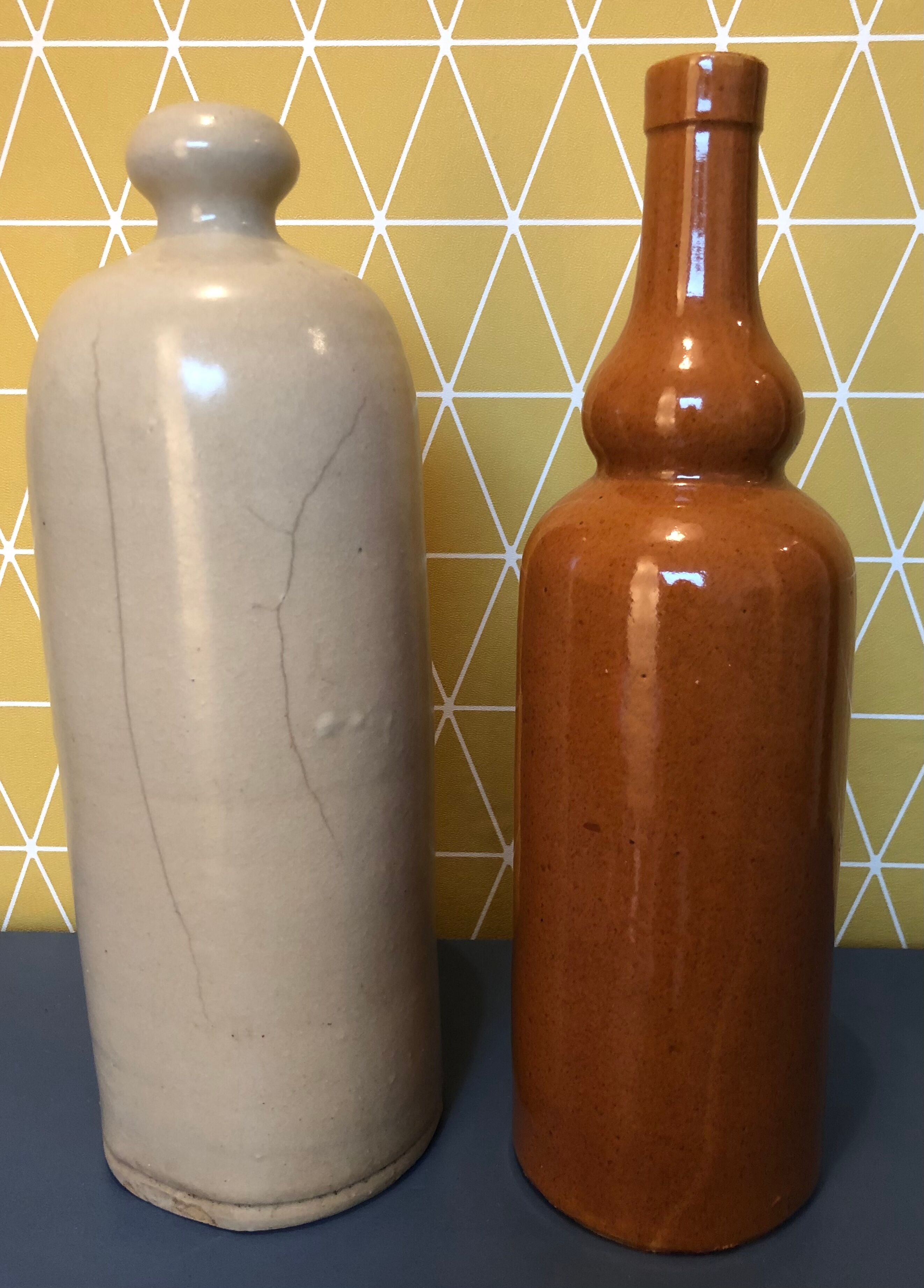 Duo of sandstone bottles