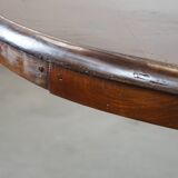 Wooden round 4-person dining table with detailed leg