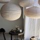 Average suspension in natural rattan and linen, Japanese-style, flattened oval in pink.