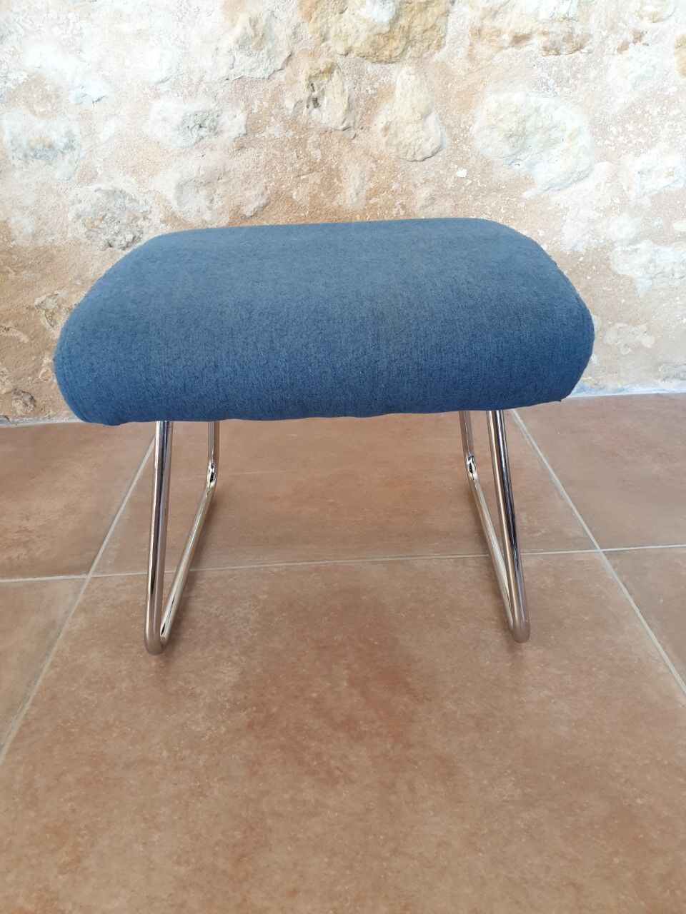 Armchair and its footrest