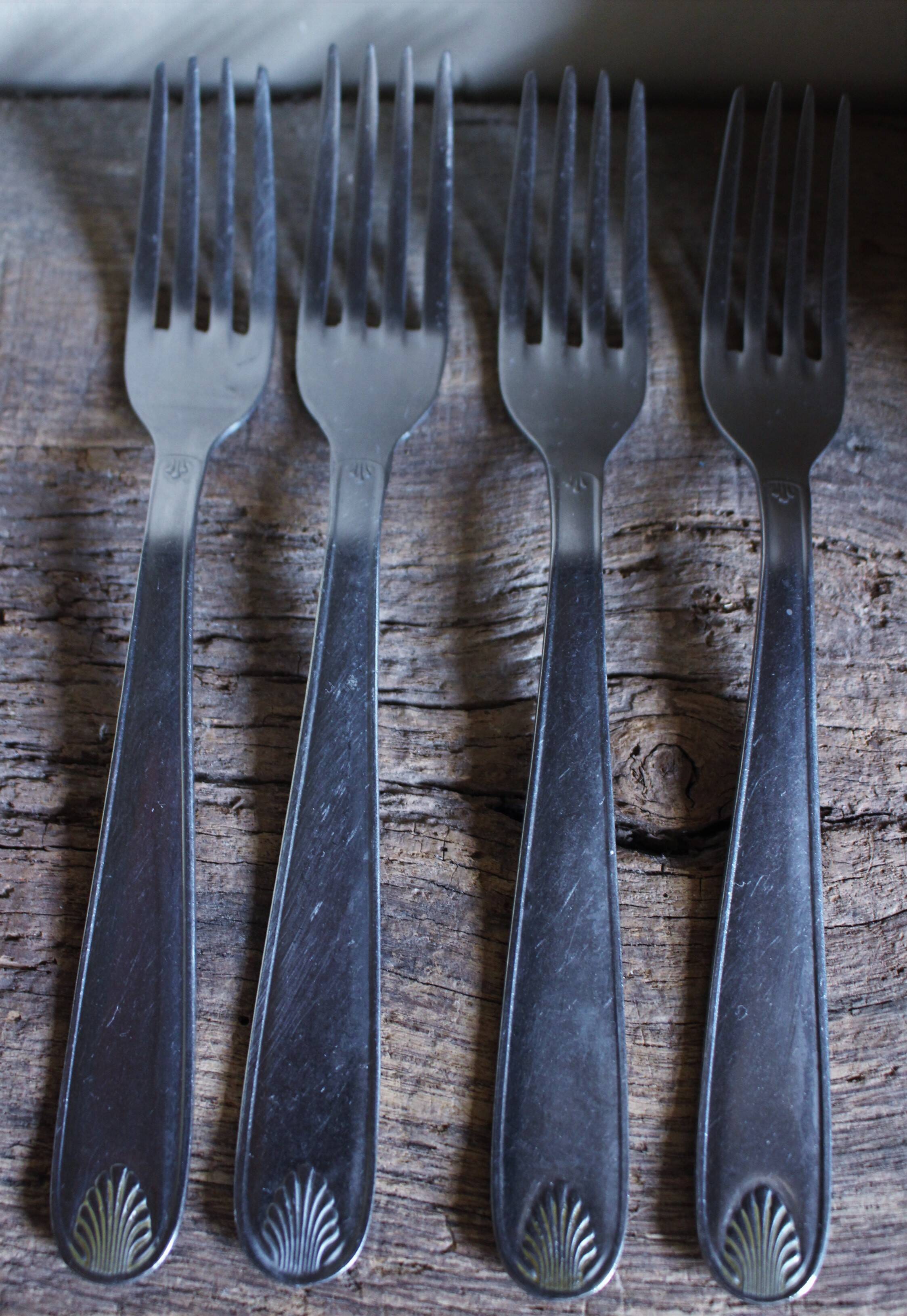 Mismatched set of 8 forks + 8 vintage shell stainless steel knives