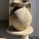 Petrified wood catchall or dish in beige with several grey spots in the centre.