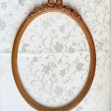 Oval frame with gilded pediments 19th wood and stucco