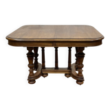 Henri II walnut table from the early 20th century with extensions.