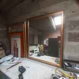 Old mirror of period handmade by cabinetmaking and decorated with gold leaf