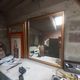 Old mirror of period handmade by cabinetmaking and decorated with gold leaf
