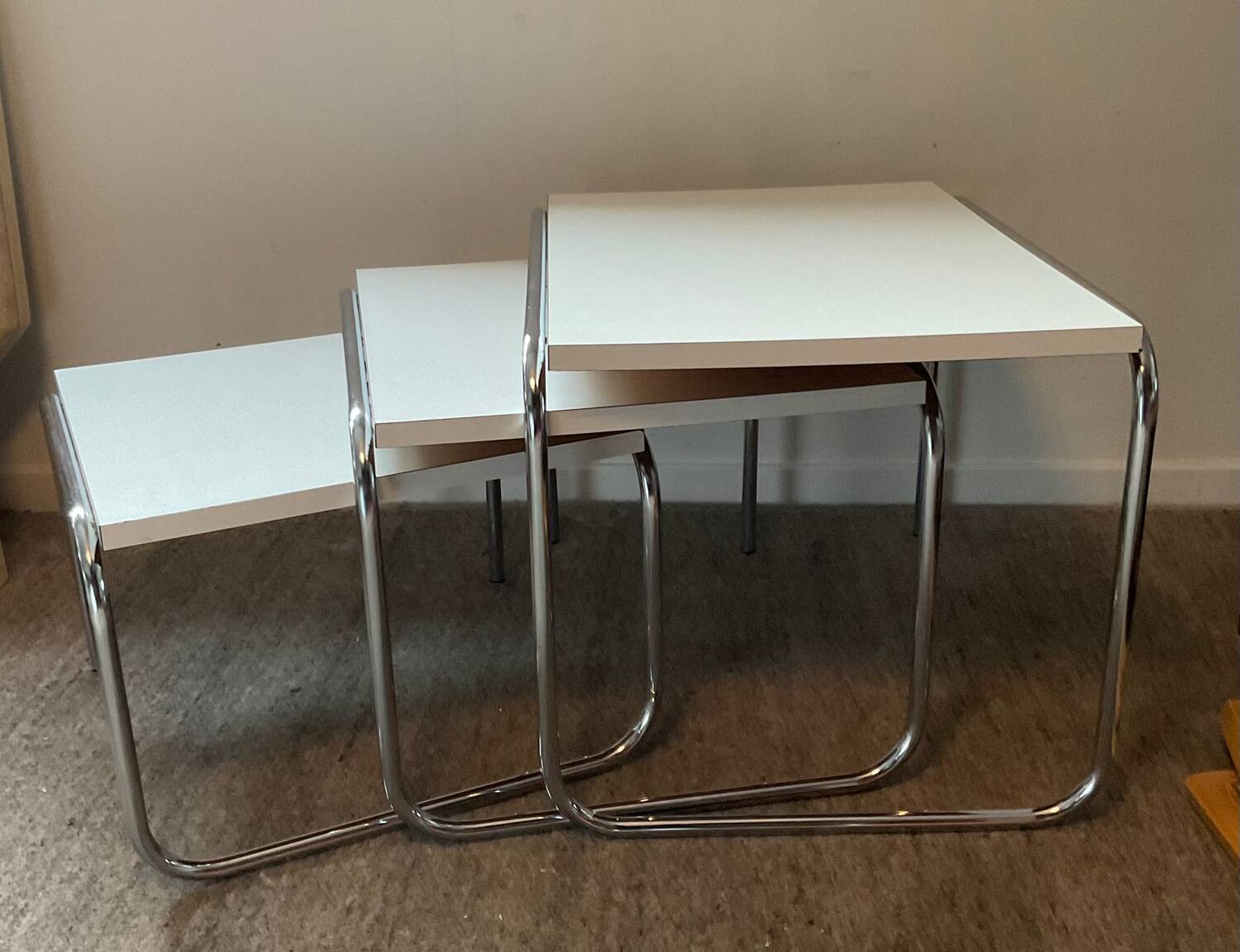 Trio of vintage nesting tables in Formica and chrome metal