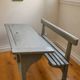 Old school desk for two with ink wells.