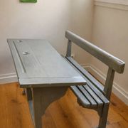 Old school desk for two with ink wells.