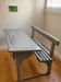 Old school desk for two with ink wells.