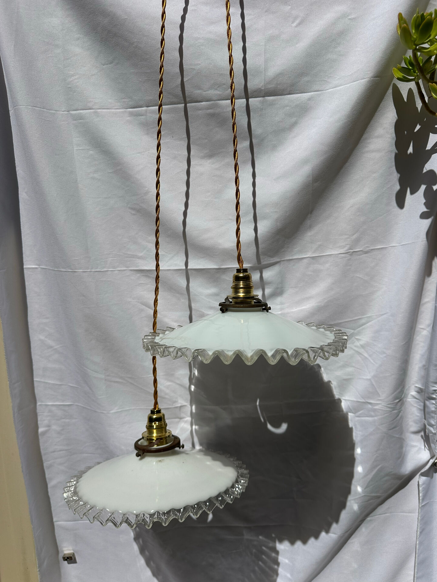 Vintage wavy opaline suspension pair with brass claw