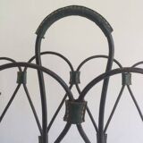 Magazine rack in leather and black lacquered metal. Attributed to Jacques Adnet