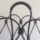 Magazine rack in leather and black lacquered metal. Attributed to Jacques Adnet