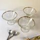 Trio of glass dessert bowls with gold rims, La Rochère, France