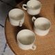 4 cups in ecru and gold Sarreguemines earthenware