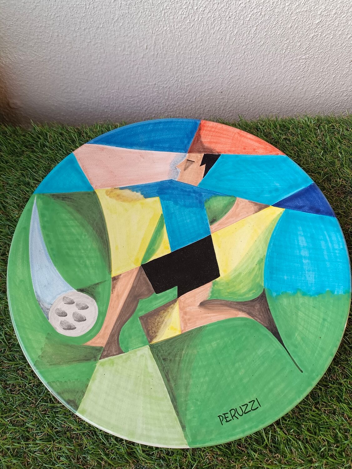 Osvaldo Perruzzi designer of polychrome faience plates.
