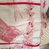 Large white tablecloth and red handmade embroidery. Lace surround;