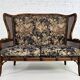 Wingback 2-seater sofa in carved wood, cane and fabric