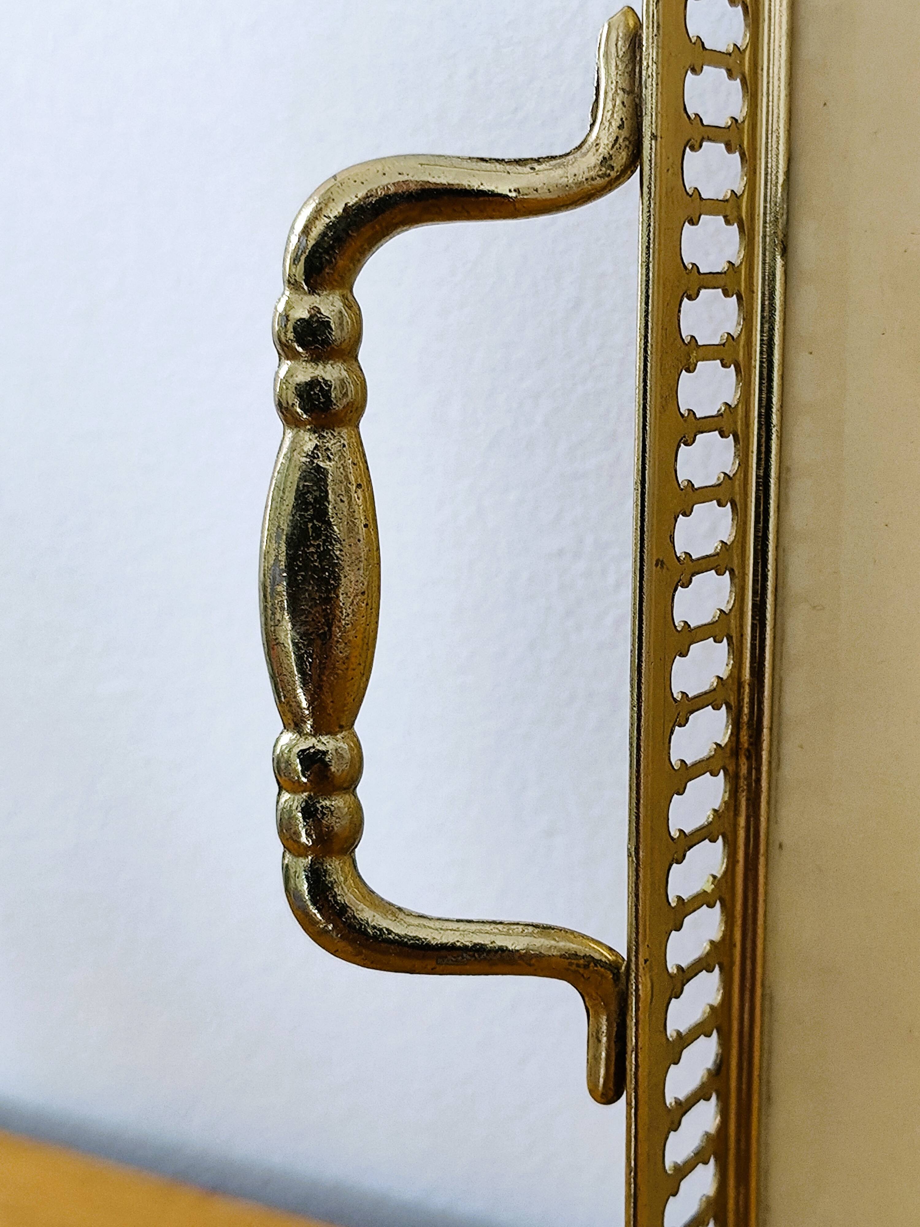 Vintage service tray with a golden gallery and mirror, decorated with ducks.