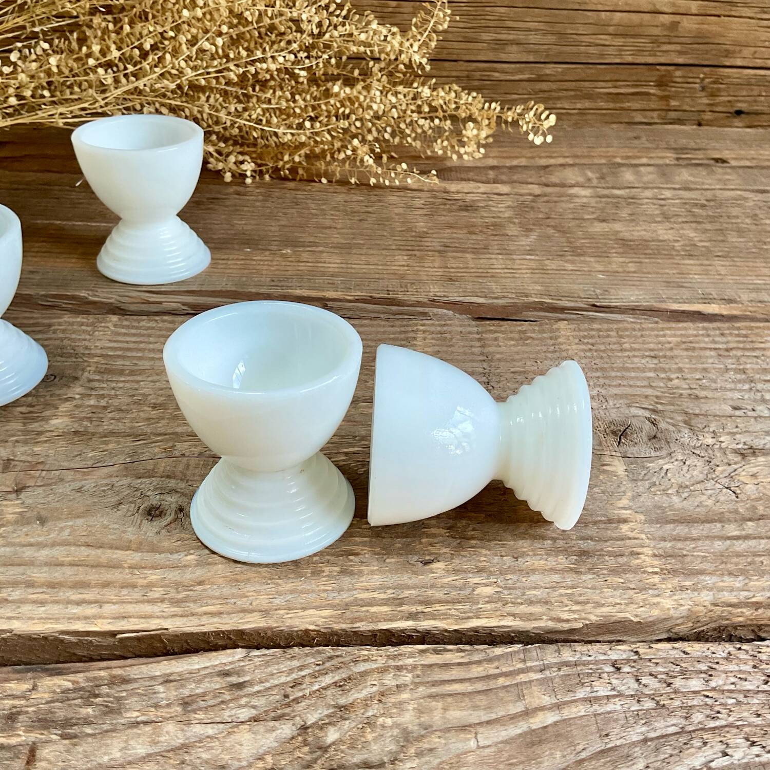 4 egg cups in white opaline glass