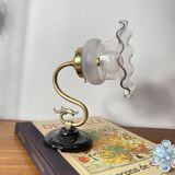 Swan neck wall light in brass with glass tulip.