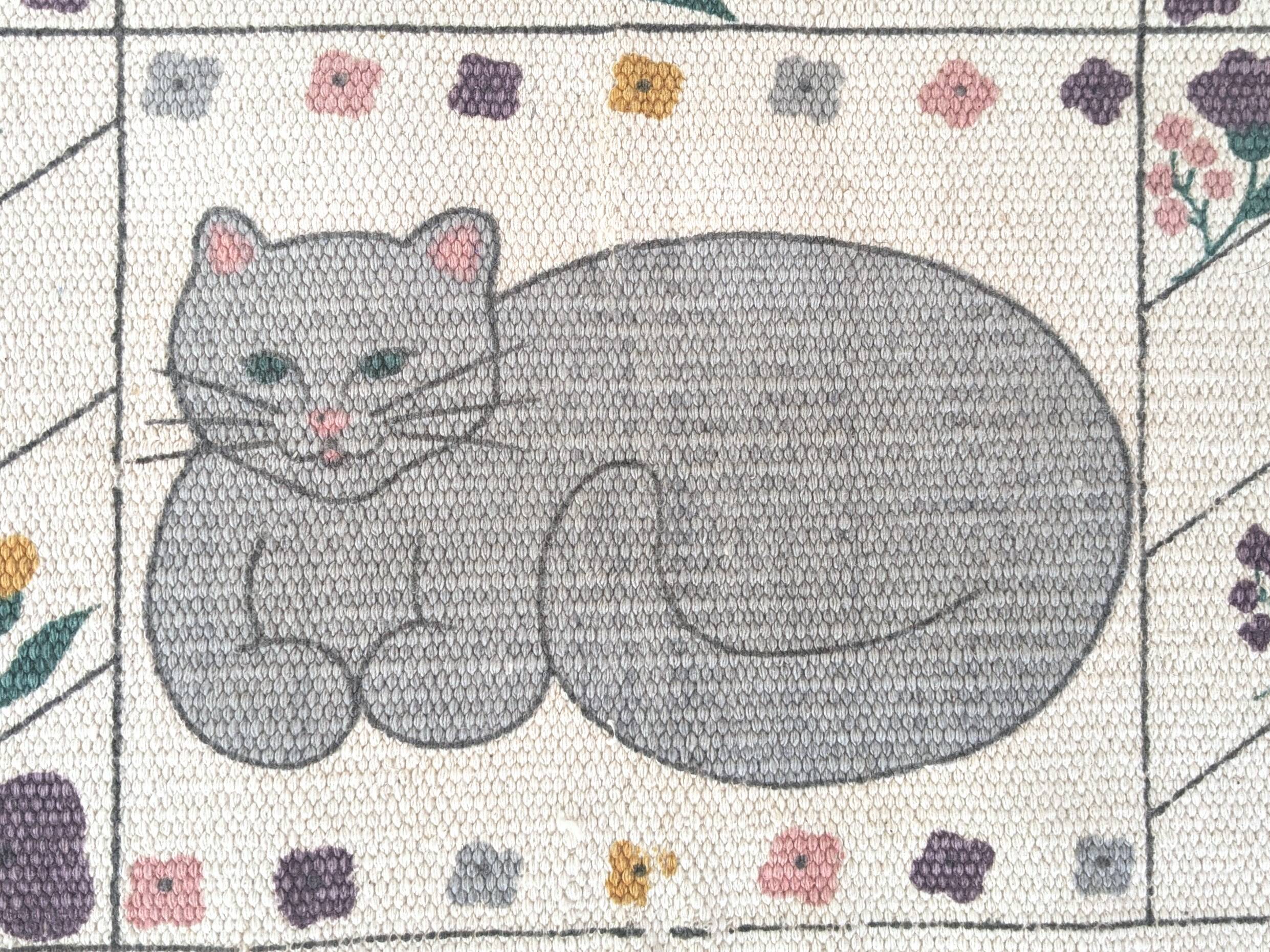 1980s handwoven cotton rug with a cat and flower pattern