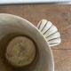 Antique champagne bucket with shell handles.