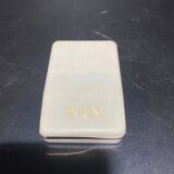 Lighter with its golden box