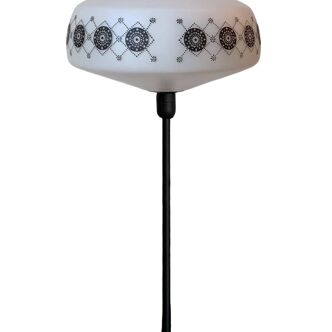 Table lamp with a vintage white glass globe and a black base