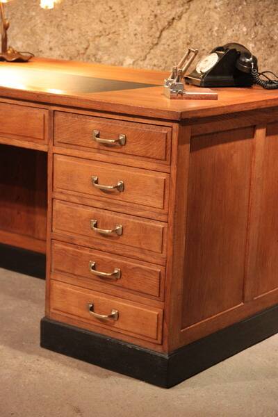 Double administrative desk with cupboard and drawer.