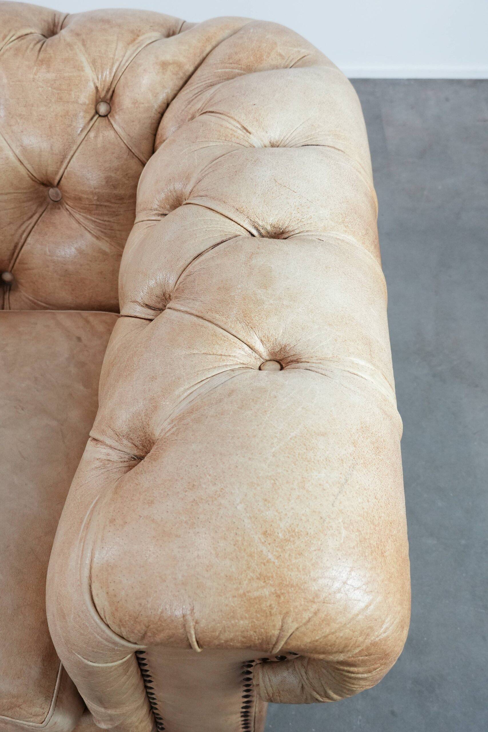 Chesterfield armchair made of cowhide leather in a light cognac colour